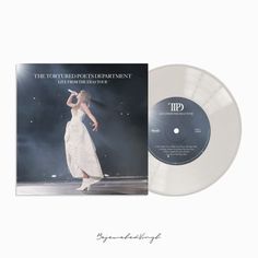 a white vinyl record with an image of a woman on stage