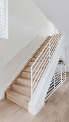 there is a white stair case in the house