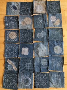 several pieces of denim with embroidered designs on them