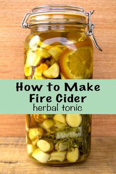 how to make fire cider with herbs and lemons in a jar on a wooden table