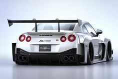 the rear end of a white sports car