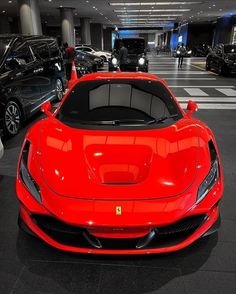 a red sports car parked in a parking garage