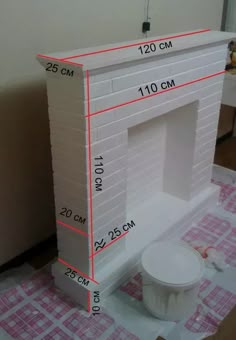 a white brick fireplace being built with measurements for the size and width on each side