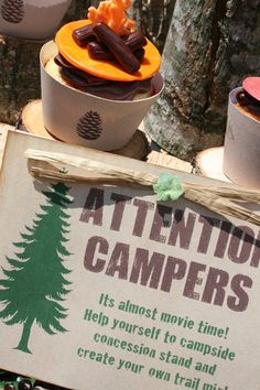 there is a sign that says attentive campers and some cups with food in them