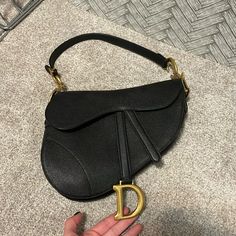 Black Grained Calfskin Dior Saddle Bag. This Is Iconic! Only Used A Few Times - Minor Wear But Essentially Like New! See All Pics And Video. I Can Include The Dustbag, Too! This Is The Larger Size Not The Mini! Dimensions: 25.5 X 20 X 6.5 Cm / 10 X 8 X 2.5 Inches (Length X Height X Width) Black Dior Saddle Bag, Dior Saddle, Dior Handbags, Saddle Bag, Dior Bag, Dior Saddle Bag, Saddle Bags, Saddle, Calf Skin