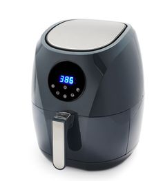 an alarm clock on top of a black air fryer with the time at 3 30