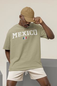 Step into the timeless charm of Mexico with our Mexico 90s Style T-shirt, a stylish wardrobe essential that captures the spirit of this vibrant country. Available in a palette of 9 captivating colors, this t-shirt invites you to embrace the rich culture and colorful traditions of Mexico while enjoying unparalleled comfort and style. A Tribute to Mexican Heritage: Our Mexico 90s Style T-shirt pays homage to the diverse heritage and cultural richness of Mexico. Each color option reflects a differe Cheap Casual T-shirt For Cinco De Mayo, San Juditas Shirts, Cheap Cotton Shirt For Cinco De Mayo, Mexico Squad Shirts, Baggy Shirt, Tshirt Oversized, Mexican Heritage, Casual Wardrobe, 90s Fashion