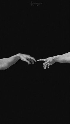 two hands reaching out towards each other in black and white, against a dark background