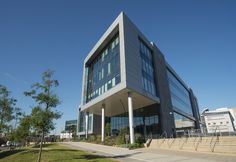 an office building with stairs leading up to it