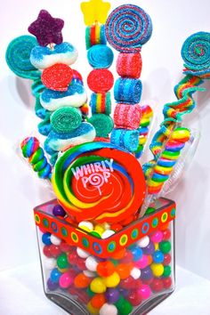 a candy bouquet with lollipops, candies and gummy bears in it