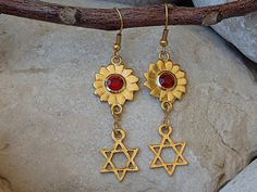 Star Of David Earrings. Gold Jewish Jewelry. Red Swarovski Earrings. Drop Jewish Symbolic Earrings. Magen David Star Charms Jewelry Gift Materials:Metal: 24K gold plated on brass nickel freeGemstone:  swarovski Measurements:Long: 4 cm \ 1.6 InchesThe earrings will be packed in a gift box.Please allow 4-5 days to prepare. I usually ship earlier than this.If you are in a rush, please let me know.FOR MY JEWISH COLLECTION HERE:https://www.etsy.com/il-en/shop/rebekajewelry?section_id=14238096&ref=sho Red Spiritual Dangle Earrings, Red Star-shaped Jewelry For Gift, Red Star-shaped Nickel-free Earrings, Nickel-free Red Star Earrings, Red Star-shaped Jewelry Gift, Handmade Red Star Jewelry, Red Spiritual Jewelry, Ruby Red Necklace, David Star