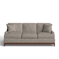 an image of a couch with pillows on the top and bottom half, in grey fabric