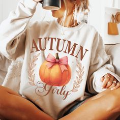 Enjoy the cozy vibes of autumn with our Cozy Pumpkin Spice Shirt! This women's fall crewneck is perfect for the season, featuring a cute pumpkin design that captures the essence of autumn. Made from soft, high-quality fabric, this pumpkin sweatshirt offers warmth and style, making it a must-have for your fall wardrobe. Whether you're sipping on your favorite coffee, enjoying Halloween festivities, or just relaxing at home, this autumn coffee sweater will keep you comfortable and stylish. The gir Cute White Fall Sweatshirt, Cute White Sweatshirt For Fall, Cute Long Sleeve Fall Sweatshirt, Cute Long Sleeve Sweatshirt For Fall, Cute Fall Letter Print Sweatshirt, Cute Graphic Print Sweater For Fall, Cute Letter Print Sweatshirt For Fall, Pumpkin Patch Photoshoot, Girly Halloween