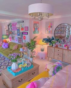 a living room filled with lots of furniture and flowers in vases on the coffee table