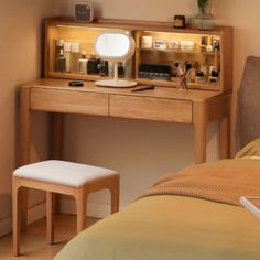 a wooden desk with a mirror on it and a stool in front of the desk