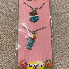 three necklaces are in the package on the floor, one is for kids and one is for adults