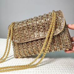 Add some sparkle to your outfit with our Glamorous Chain Strap Handbag. This stunning bag is designed for luxurious women who want to make a statement. With its diamond shoulder bag and gold chain strap, it's the perfect accessory for a party or a night out. Experience true luxury with our exclusive bag. Glamorous Clutch Bag With Chain Detail, Glamorous Clutch Bag With Chain, Rectangular Chain Shoulder Bag For Parties, Gold Shoulder Bag Clutch With Chain, Gold Shoulder Clutch With Chain, Party Crossbody Shoulder Bag With Chain, Trendy Party Bags With Chain Detail, Gold Shoulder Bag With Chain Detail, Evening Crossbody Bag With Chain