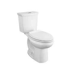 a white toilet sitting on top of a white floor