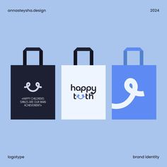 three shopping bags with the words happy tooth on one side and an q on the other