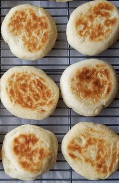 eight biscuits on a cooling rack ready to be baked