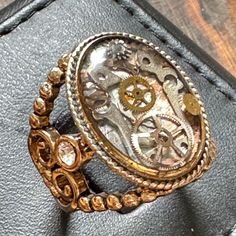 "Embrace the charm of our delightful steampunk ring, a unique handmade accessory that captures the spirit of vintage style. Crafted with care, this ring features intricate details like clock gears and decorative accents, making it a standout piece in any jewelry collection. Perfect for layering with other rings or wearing on its own, it adds a whimsical touch to both casual and formal outfits. Celebrate your unique style and make a statement with this enchanting ring!" Steampunk Ring, Clock Gears, Steampunk Rings, Formal Outfits, Own It, Decorative Accents, Ring Unique, Formal Outfit, Handmade Accessories