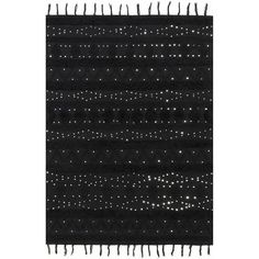 a black rug with white dots and fringes on the bottom, in front of a white background