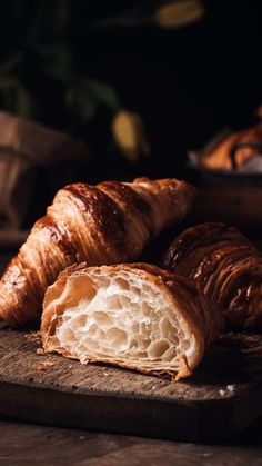 some croissants are on a cutting board