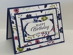 a happy birthday card with flowers on it