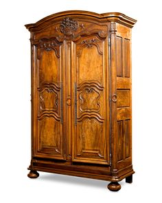 an old wooden armoire with carvings on it