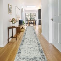 the hallway is clean and ready for guests to use it as a dining room area