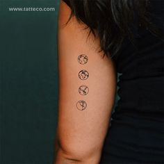 a woman's arm with four different tattoos on it