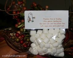 a bag of marshmallows sitting on top of a table next to other christmas decorations