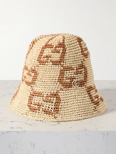 Gucci's bucket hat is woven from lightweight straw with contrasting 'GG' motifs throughout - you'll have to look closely to notice the matching tiny, gold-tone plaque just above the brim. It's the perfect accessory for warm days in the city or on vacation. Gucci Bucket Hats, Gucci Bucket Hat, Straw Bucket Hat, Orlebar Brown, Flat Dress Shoes, Floral Dresses Short, Raffia Bag, Hat Designs, Fashion Bracelets