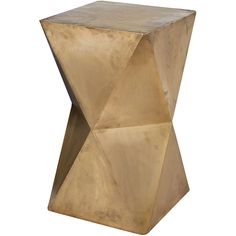 a gold colored side table with geometric design