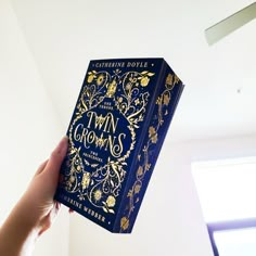 A dark blue book with stained edges and gold detailing Fairyloot Books, Twin Crowns, Fancy Books, Romantasy Books, Book Photography Instagram, Book Reading Journal