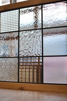 a window with several different colored glass panes