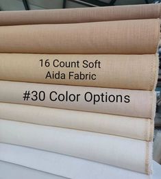 four different colors of fabric with the words, 16 count soft aid fabric 30 color options