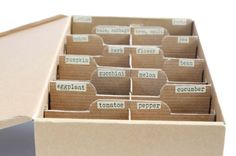 an open cardboard box filled with lots of labels