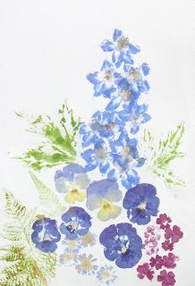 blue and purple flowers are in a vase