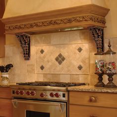 a stove top oven sitting inside of a kitchen next to a wall mounted range hood