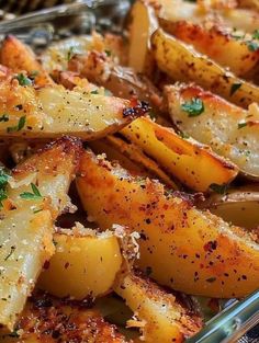 cooked potatoes with parmesan cheese and herbs