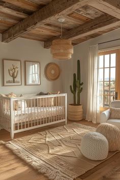 a baby's room with a crib, rocking chair and cactus