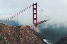 an aerial view of the golden gate bridge on a foggy day in san francisco, california