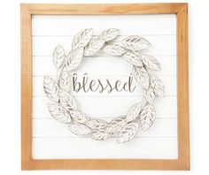 a wooden framed sign with the word,'blessed'written on it