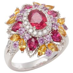 This ring designed by David Jerome is from his private collection and features one oval cut Ruby sourced in Mozambique totalling 1.17cts. Set with a mix of round brilliant cut Diamonds, Rubies, pink and yellow Sapphires totalling 2.72cts combined. Mounted in platinum. Ring size UK N, EU size 54, USA size 6 1/2. David prides himself in only sourcing the finest and most exclusive gemstones whose natural beauty and colour enhance the settings he creates for each piece. These exclusive designs offer buyers a unique opportunity to own the kind of jewellery usually reserved for the finest and most exclusive brands in the world. A real legacy for the future. Sapphire Cluster Ring, Diy Necklace Making, Expensive Rings, Bridal Jewels, Sparkling Jewelry, Yellow Sapphire Rings, Genie Bottle, Sparkly Jewelry, Contemporary Ring