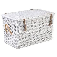 a large white wicker basket with handles