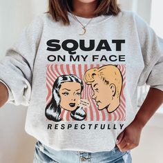 "Squat on my Face Respectfully, Funny Gym Sweater, Weightlifting Sweatshirt, Pump Cover, Men Gym, Women Cute Gym, Cute Gym Clothes, Gym Gift Shirt reads: SQUAT ON MY FACE... RESPECTFULLY Speech bubble reads: \"You had me at squat...\" ABOUT THE SWEATSHIRT👕 Ideal for any situation, a unisex heavy blend crewneck sweatshirt is pure comfort. These garments are made from polyester and cotton. This combination helps designs come out looking fresh and beautiful. The collar is ribbed knit, so it retains its shape even after washing. There are no itchy side seams on these sweaters.  .: 50% cotton, 50% polyester .: Medium-heavy fabric (8.0 oz/yd² (271.25 g/m .: Loose fit .: Sewn-in label .: Runs true to size Please see size chart in photo listings for reference.  We do recommend taking your favorit Funny Gym Tops With Crew Neck, Funny Crew Neck Gym Tops, Graphic Print Sweatshirt For Gym Use In Fall, Fall Gym Sweatshirt With Graphic Print, Graphic Crew Neck Sweatshirt For Workout, Graphic Print Crew Neck Sweatshirt For Workout, Graphic Print Crew Neck Workout Sweatshirt, Graphic Print Sweatshirt For Fall, Workout Sweatshirt With Graphic Print, Relaxed Fit