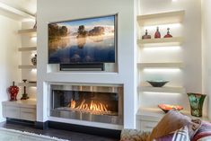 a living room with a fire place and shelves