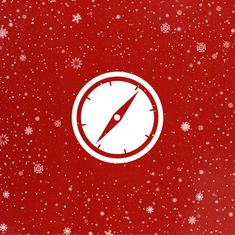 a red background with snowflakes and a compass