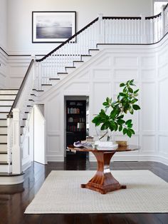 the stairs in this house are white and wood